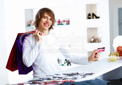 Young man doing shopping