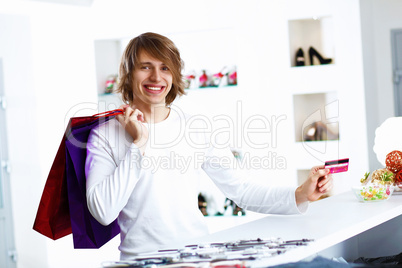 Young man doing shopping