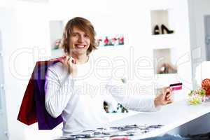 Young man doing shopping