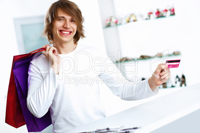 Young man doing shopping