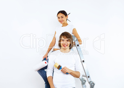 Young couple with paint brushes together