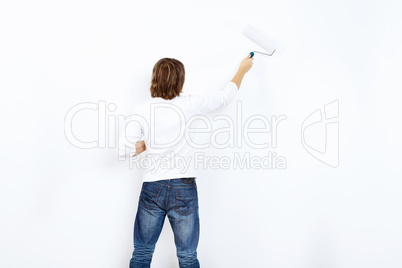 Young man with paint brush