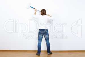 Young man with paint brush