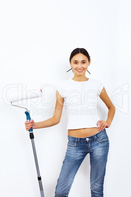 Young woman with paint brushes