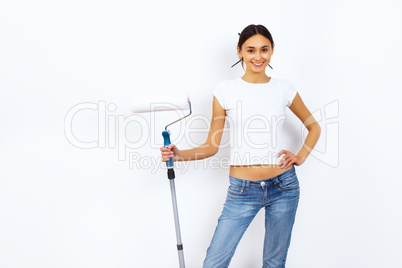 Young woman with paint brushes