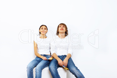 Young couple with paint brushes together