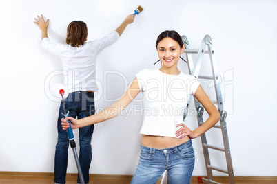 Young couple with paint brushes together