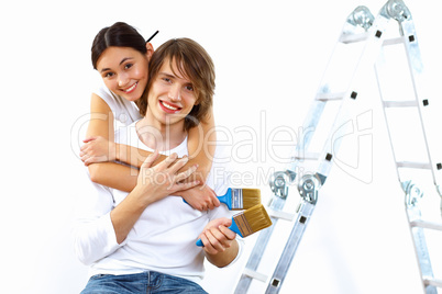 Young couple with paint brushes together