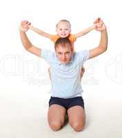 father and little daughter doing sport