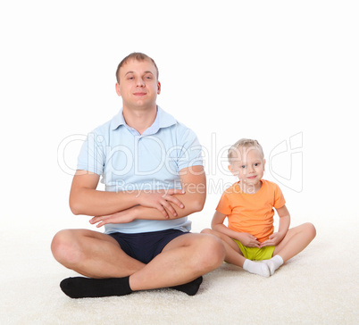 father and little daughter doing sport