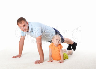 father and little daughter doing sport