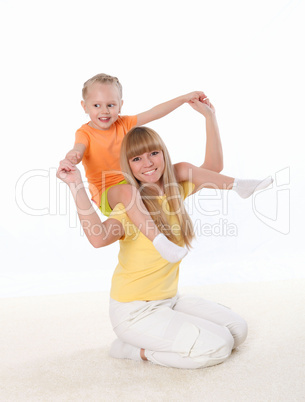 mother and little daughter doing sport together