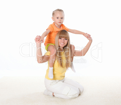 mother and little daughter doing sport together