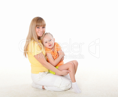 mother and little daughter doing sport together