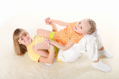 mother and little daughter doing sport together