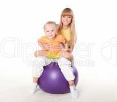 mother and little daughter doing sport together