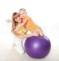 mother and little daughter doing sport together