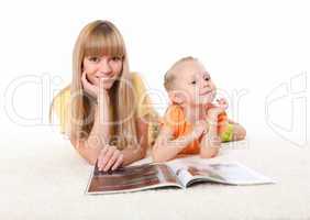 young mother reading a book to his daughter