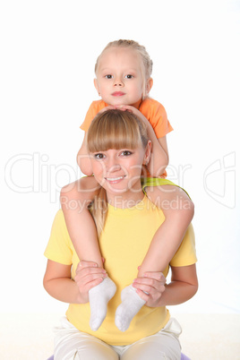 mother and little daughter doing sport together