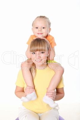 mother and little daughter doing sport together