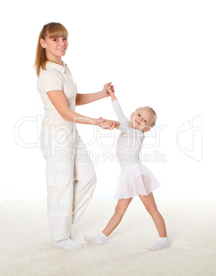 mother and little daughter doing sport together