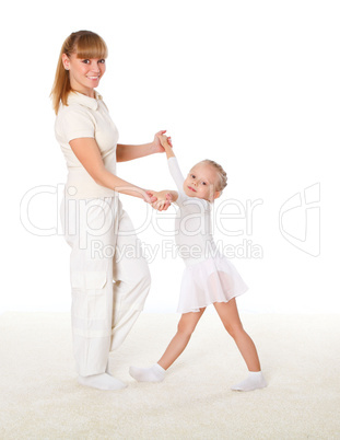 mother and little daughter doing sport together