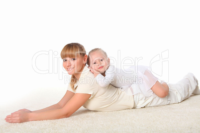 mother and little daughter doing sport together