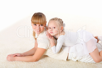 mother and little daughter doing sport together