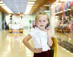 Little girl doing shopping