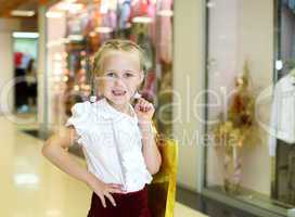 Little girl doing shopping
