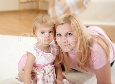 mother with her little daughter at home