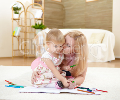 mother with her little daughter at home