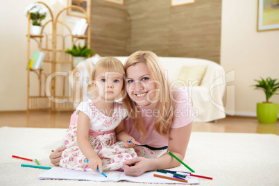 mother with her little daughter at home