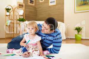 father with his little daughter at home