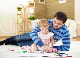 father with his little daughter at home