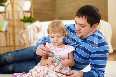 father with his little daughter at home