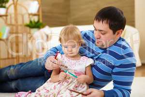 father with his little daughter at home