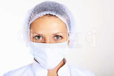 Young female scientist wearing face mask