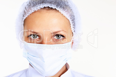 Young female scientist wearing face mask