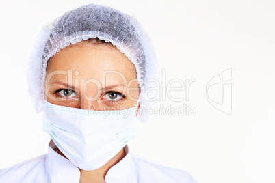 Young female scientist wearing face mask