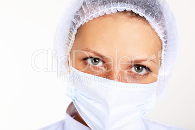 Young female scientist wearing face mask