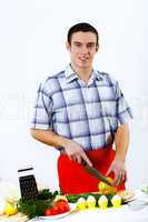 Man cooking fresh meal at home