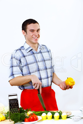 Man cooking fresh meal at home