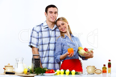 Husband and wife together coooking at home