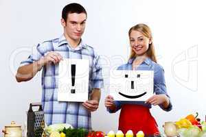 Husband and wife together coooking at home