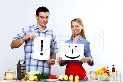 Husband and wife together coooking at home