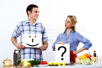 Husband and wife together coooking at home