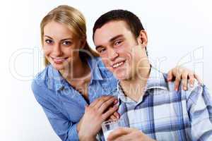 Husband and wife together coooking at home