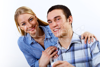 Husband and wife together coooking at home