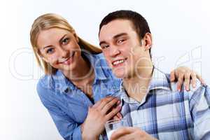 Husband and wife together coooking at home